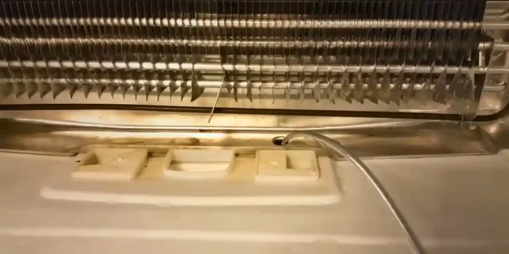 how to unclog defrost drain on lg refrigerator