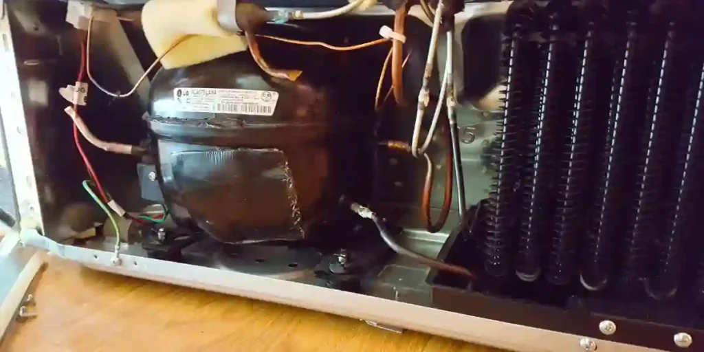 refrigerator makes popping noise when compressor shuts off